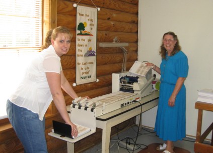 Donna and Carole labeling and tying Bread Magazine